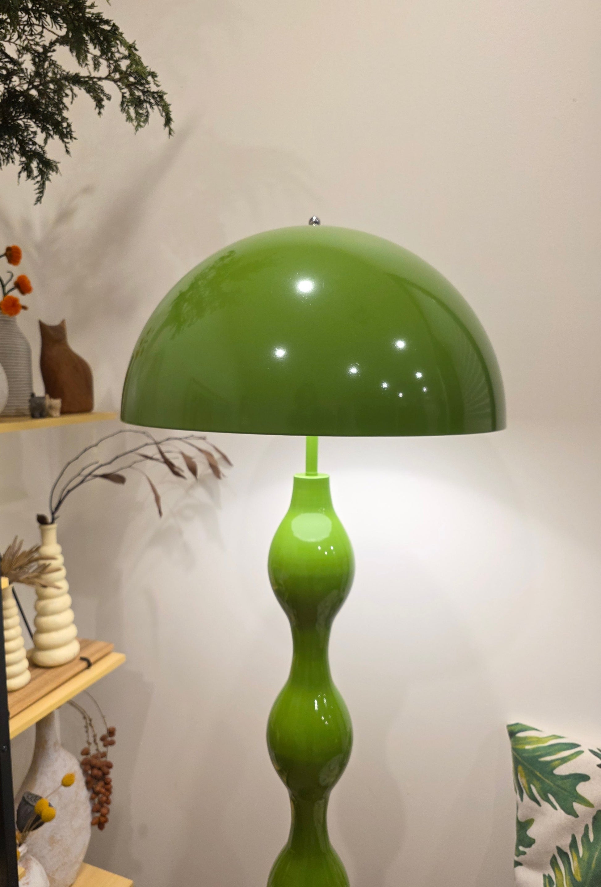 Dori Wavy Mushroom Floor Lamp in Olive Green with sculptural wavy base with a unique design on a white wall background