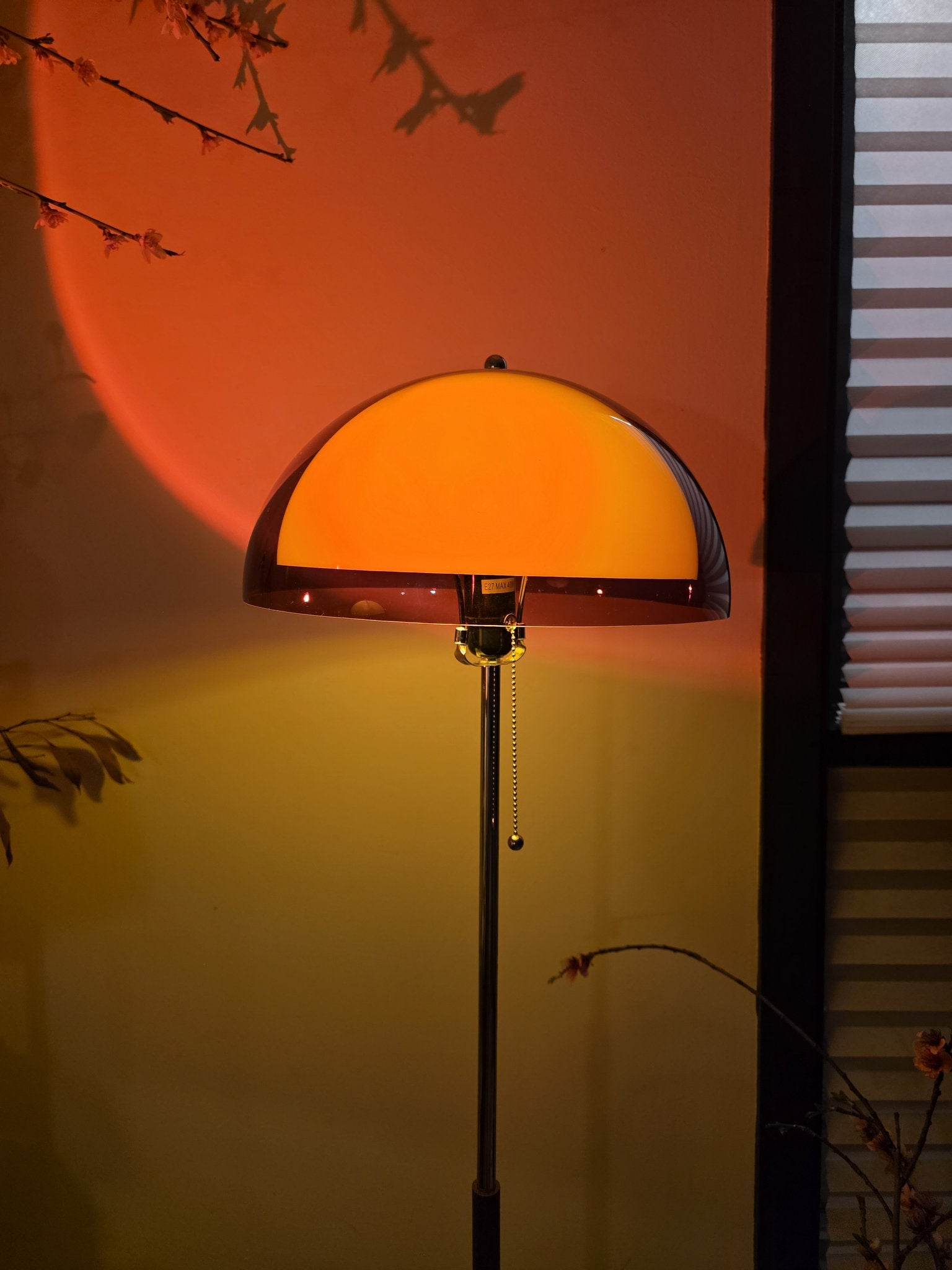 Coby+ Mushroom Bauhaus Floor Lamp Orange with Pull Chain Orange floor lamp casting a shadow on a wall with a window in the background