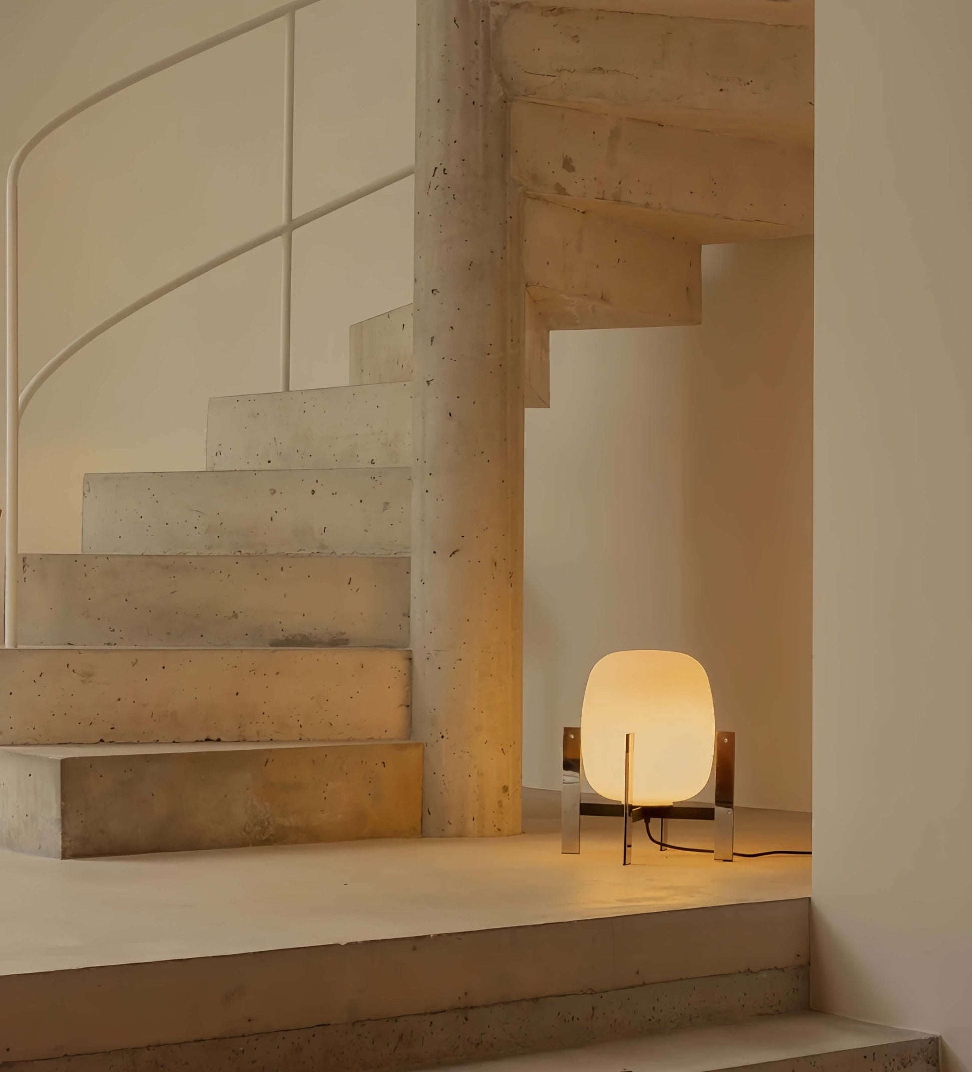 Alix Cesta Metálica Basket Lamp with chrome legs and frosted glass on a staircase with warm glow