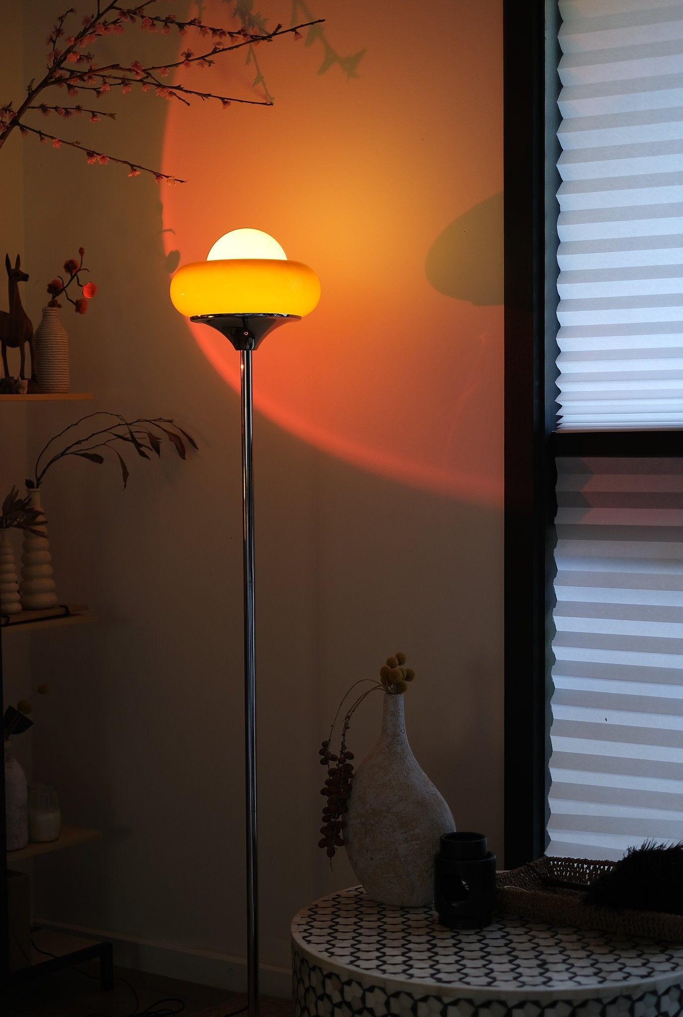 Retro Bauhaus lamp casting warm ambient glow in modern living room