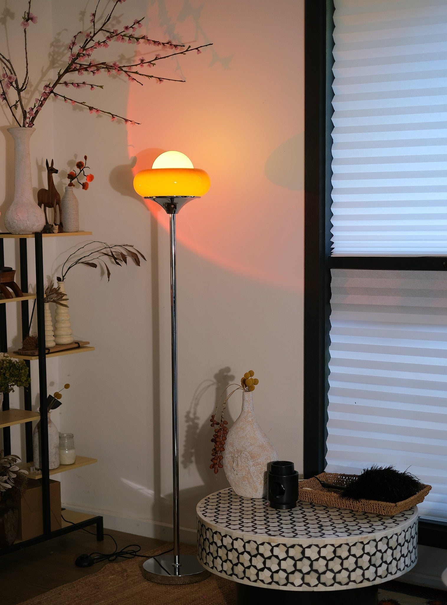 Egg Tart Floor Lamp with orange dome glass shade and white globe center in a room setting