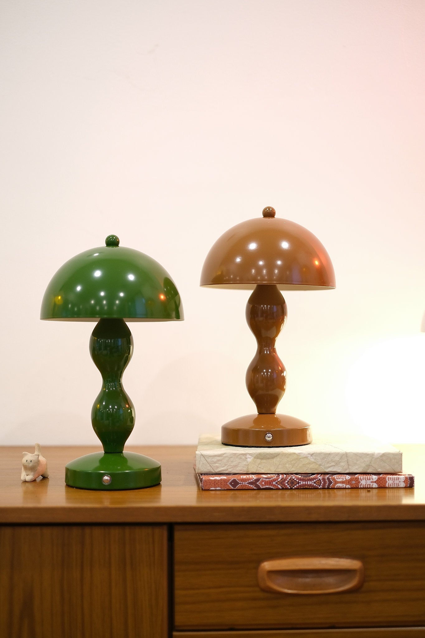 Dori Portable LED Table Lamp in Olive Green and Mocha Brown on wooden table on a wooden surface with a plain background