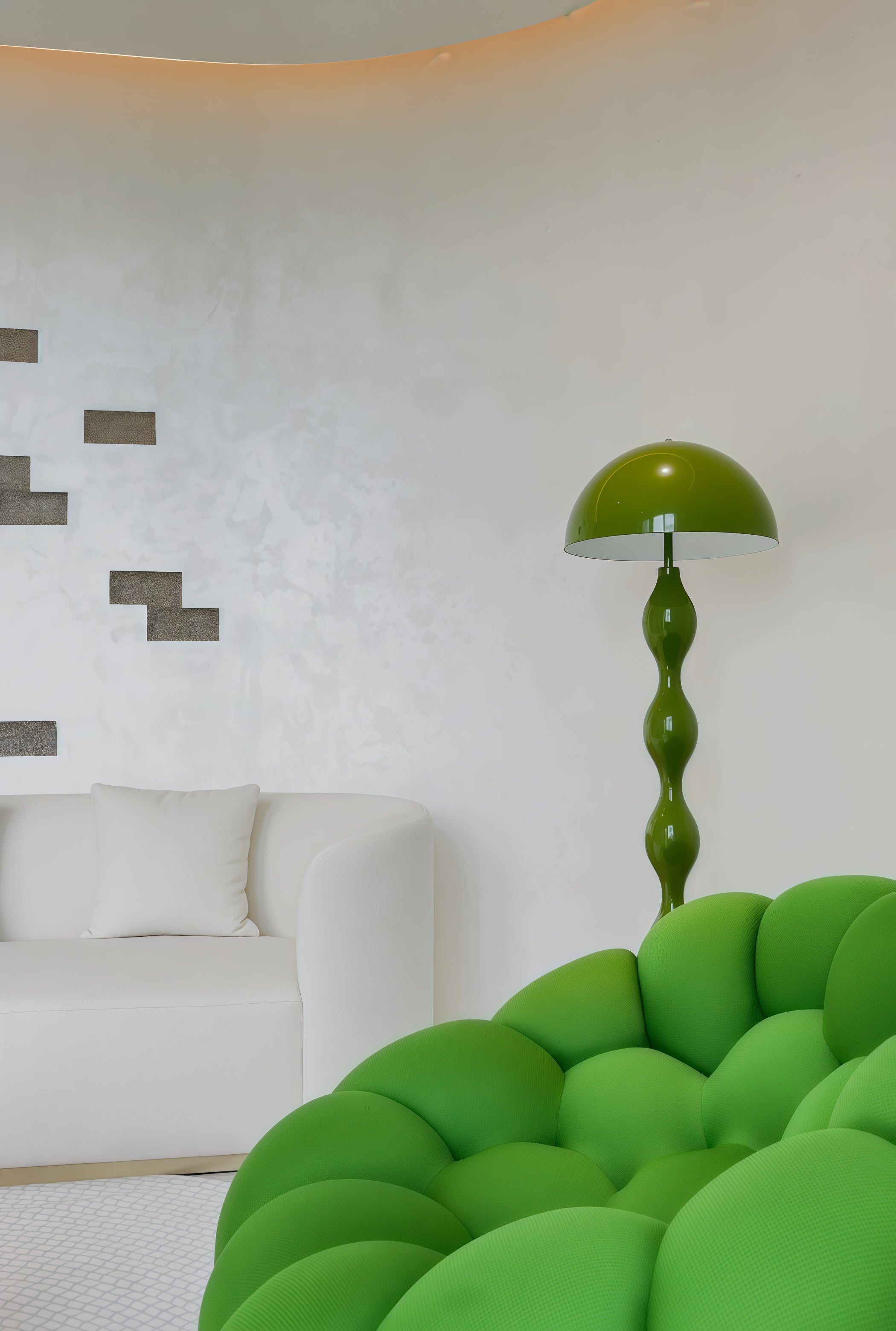 Green sofa and Dori Wavy Mushroom Floor Lamp in Olive Green with sculptural wavy base in a modern living room with white walls.
